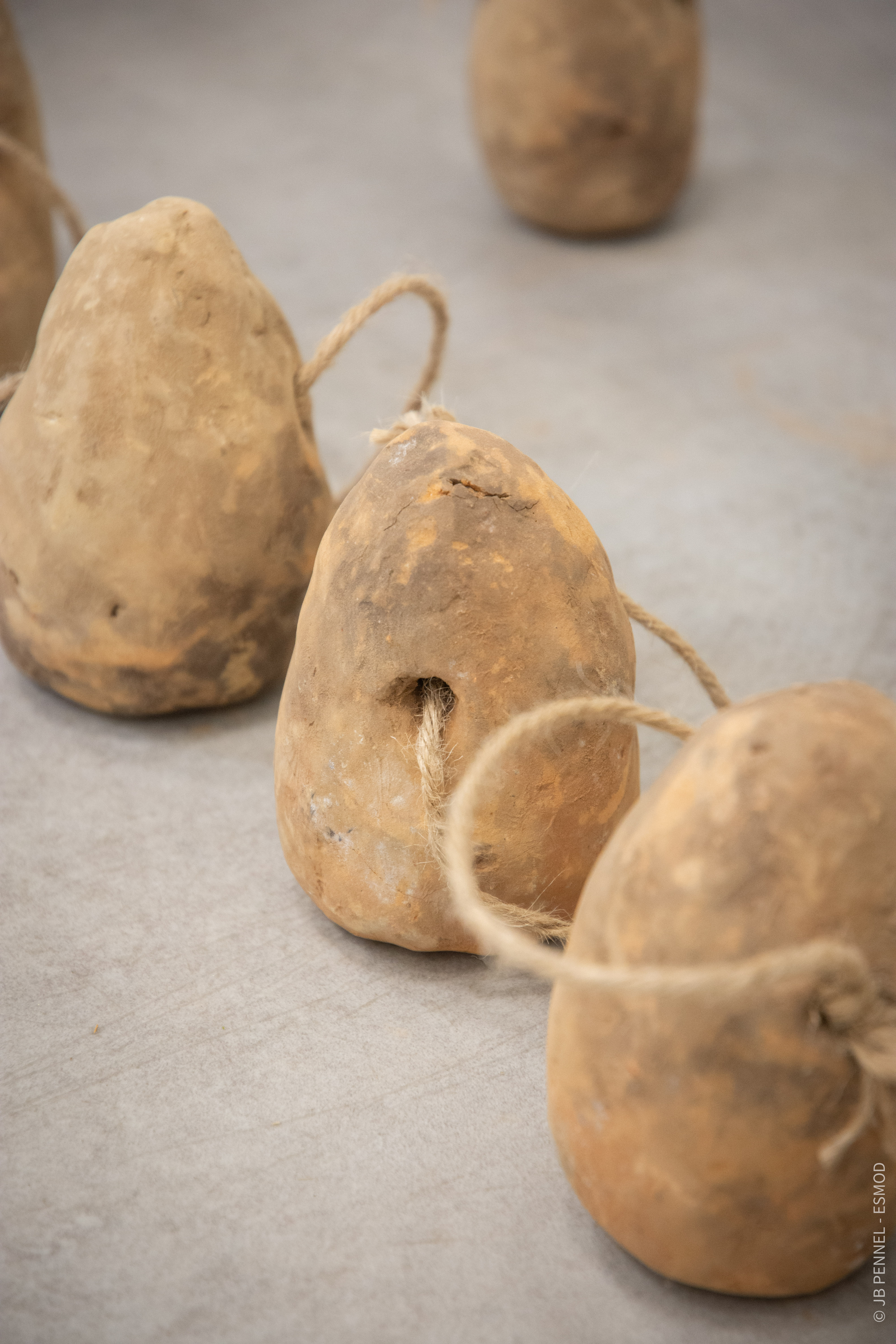 Pesons en terre cuite